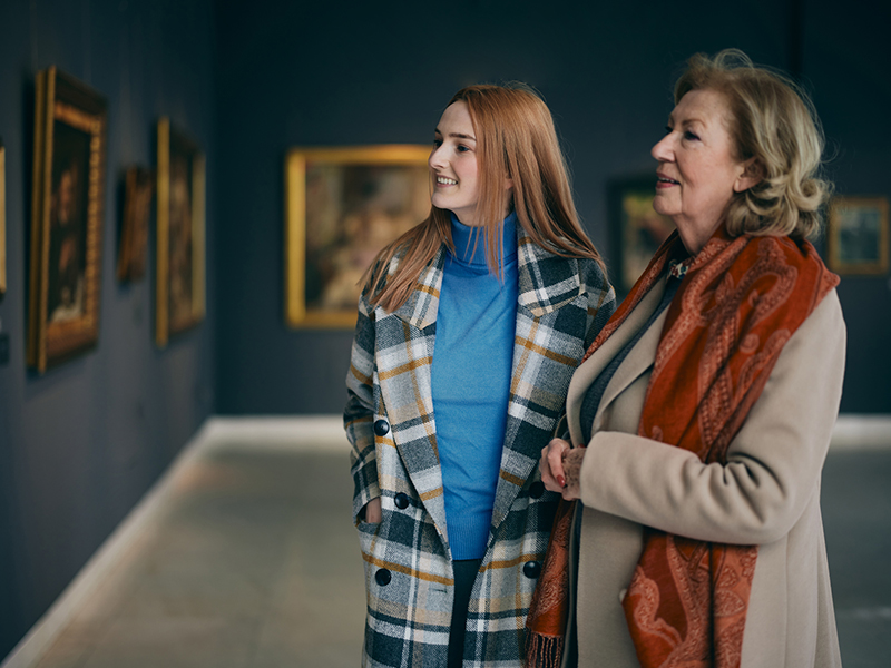 mother with her daughter on art museum